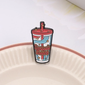Creative Delulu Juice enamel pin in pink cup shape with golden stars and retro metal badge