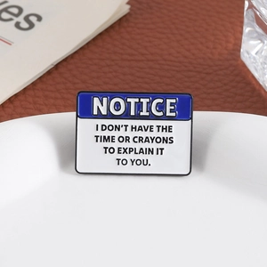 Blue 'NOTICE' enamel pin with humorous quote placed on a ceramic plate edge