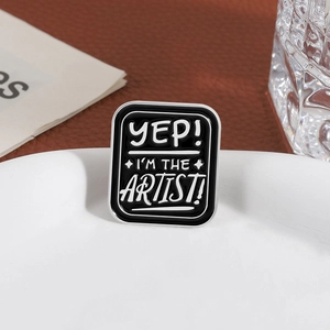 Artistic rectangle enamel pin with Yep I'm The Artist quote on black background