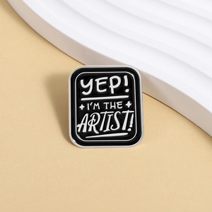 Artistic rectangular enamel pin with YEP! I'M THE ARTIST text on minimalist background
