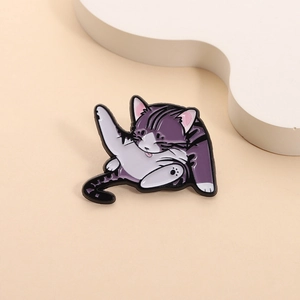 Whimsical purple and white enamel cat pin in a playful licking pose on metal