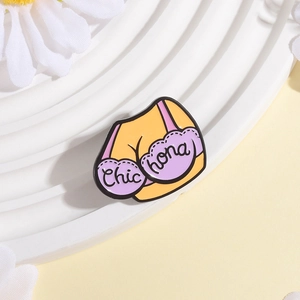 Funny enamel bikini brooch in purple and yellow with Chic text on white background