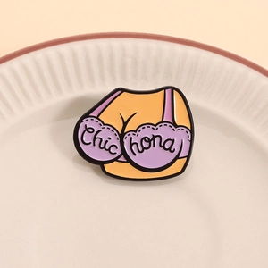 Funny enamel brooch featuring a female torso in orange vest and purple lace bra