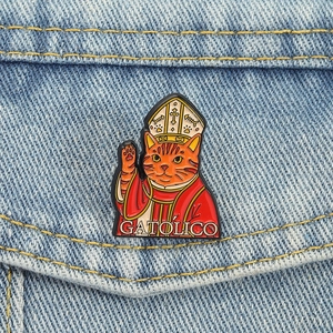 Orange cat godfather enamel brooch on denim jacket with Gatolico religious motif