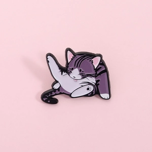 Whimsical yoga cat enamel pin with purple and white stripes on a soft pink background