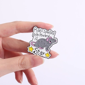 Close-up of enamel mouse brooch featuring Rats spelled backward is Star text and star icon