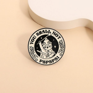 Cartoon wizard cat enamel pin with You Shall Not Pass text and retro black white patterns