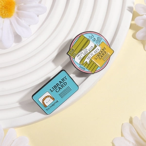 Library card and books enamel pin set with cute hedgehog illustration on white display