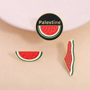 Three-piece watermelon enamel pins with Palestine flag colors and gold-plated metal borders