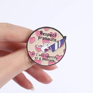 Round cat enamel pin with Respect pronouns or I will identify as a problem slogan