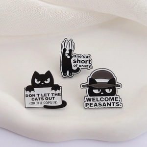 Three-piece black cat enamel pin set with humorous English quotes on a white tray