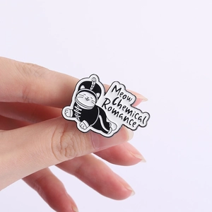 Detail of Meow Chemical Romance enamel pin featuring a cartoon cat in band uniform