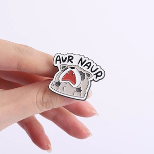 Funny cartoon raccoon enamel pin featuring AUR NAUR meme text for bags and clothing decor