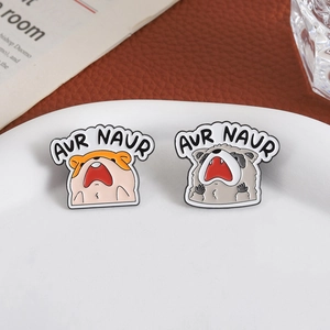 Funny enamel pins featuring screaming hamster and raccoon with AUR NAUR text design