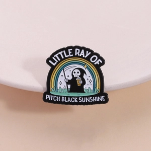 Cartoon reaper enamel pin with rainbow background and Pitch Black Sunshine text