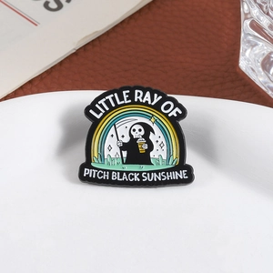Cartoon reaper pin with scythe and rainbow featuring Little Ray of Pitch Black Sunshine