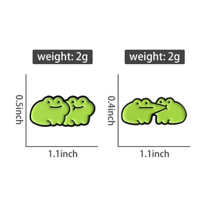 Detail view of cute green frog enamel pins showing dimensions and 2g weight for couples