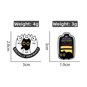 Detailed size specification for black cat enamel pins showing social battery and awkward slogans