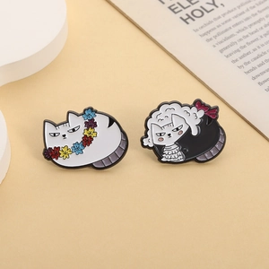 Funny cat enamel brooches featuring a flower wreath kitty and a Victorian judge cat