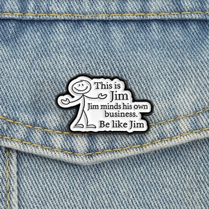 Funny 'Be like Jim' enamel pin badge on blue denim jacket pocket for causal styling