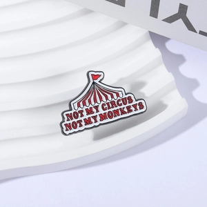 Red circus tent enamel pin with Not My Circus Not My Monkeys slogan for jackets