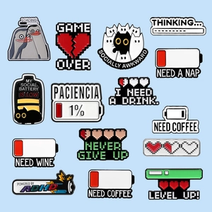 Creative pixel game and battery status enamel pins set on light blue background