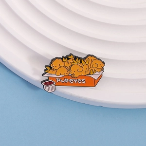 Macro detail of cartoon dog chicken nugget enamel pin on white display stand
