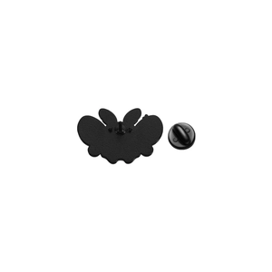 Detail of butterfly-shaped enamel pin back with black rubber clutch and matte finish
