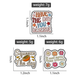 Three creative enamel pins with inspirational quotes and size specifications on white backdrop