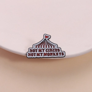 Circus tent enamel pin with Not My Circus Not My Monkeys slogan in red and white