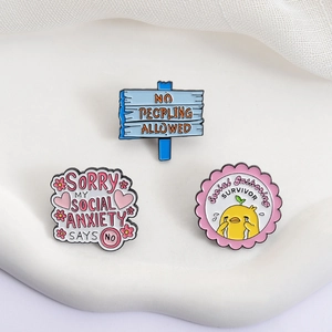 Three-piece social anxiety enamel pins set including blue warning sign and crying chick design