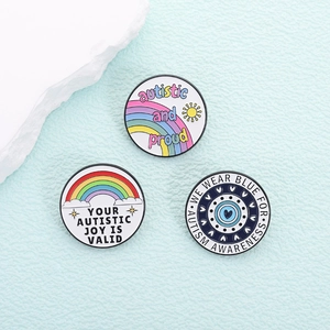 Set van 3 emaille pins voor autismebewustzijn met regenbogen en kleurrijke slogans