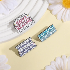 Three enamel pins set with healing quotes Happy Hurting and Healing for clothing decoration