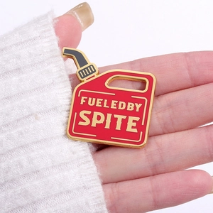 Funny red fuel can enamel pin with Fueled by Spite text on a white knit sweater
