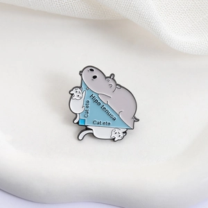 Funny math pun enamel pin featuring a hippo and cats on a blue right triangle badge