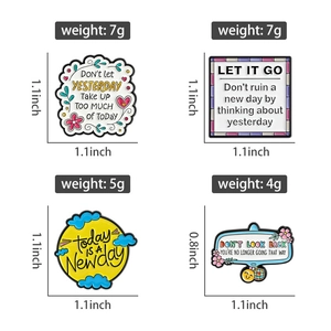 Detail view of colorful motivational enamel pins with dimensions and weight data