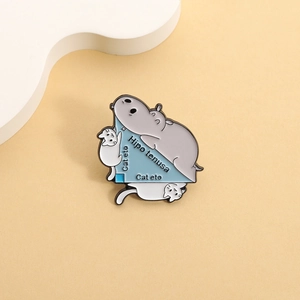 Funny math pun enamel pin with cute hippo and cats on a blue triangle metal brooch