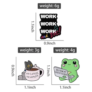 Detail view of enamel pins featuring a working cat, frog and funny office slogans