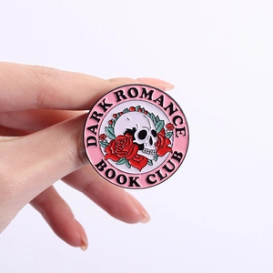 Dark Romance Book Club enamel pin with pink skull and red roses design for gothic style