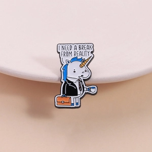 Enamel unicorn pin in office suit with coffee and I Need A Break From Reality text