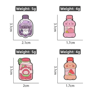 Close-up of fruit-themed cartoon bottle pins showing sizes and weights of the four designs