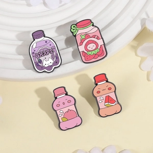 Cute fruit soda bottle enamel pins featuring grape, strawberry and peach designs