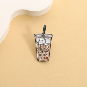 Iced coffee cup enamel pin with books spicy slogan on minimalist beige background