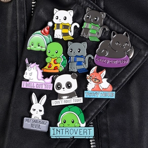 Cartoon animal enamel pins featuring panda and unicorn on a black leather jacket collar