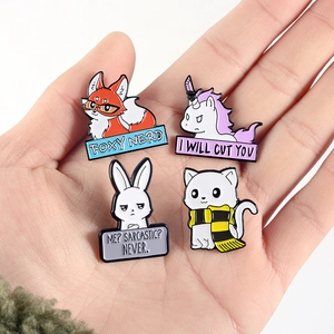 Set of four cute cartoon animal enamel pins including fox, rabbit, and cat in hand