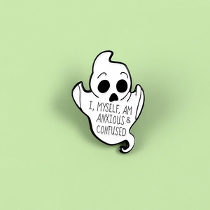 Ghost enamel pin with text 'I, MYSELF, AM ANXIOUS & CONFUSED' on green background