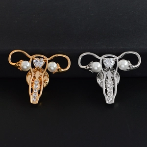 Uterus shaped enamel brooches with imitation pearls and heart zircon in gold and silver finish