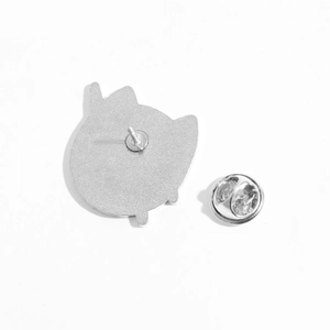 Reverse side of blue cat planet enamel pin with silver butterfly clutch back