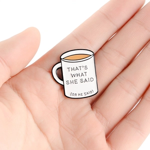 Coffee mug enamel pin badge with 'THAT'S WHAT SHE SAID' quote in white and black