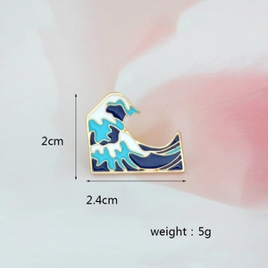 Detail view of Great Wave enamel pin with dimensions 2.4cm x 2.0cm and 5g weight info